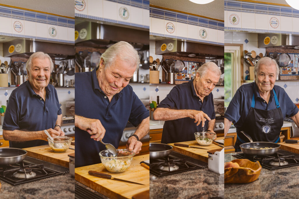 Photo: A composite image of four different photos of Jacques Pepin whipping up some pancakes. He wears a navy polo shirt in his kitchen. From left to right, he smiles for the photo, he stirs a mixture in a bowl, Pepin throws a dash of an ingredients in the bowl, and lastly, Pepin poses for the camera with his apron, while the food cooks on the pan.